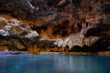 Interior of a cave with an underground hot spring - a long exposure taken at medium range