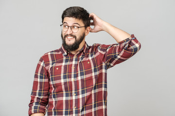 Portrait of focused smart male model with with thoughtful determined expression