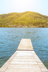 Obraz premium Pier on the beautiful summer Como lake in Italy.