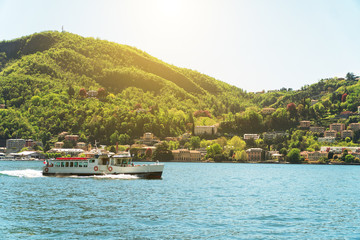 Fototapeta premium Small excursion boat floating on the Como lake in Italy.