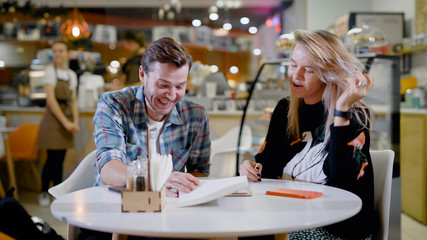 Handsome young man and attractive young woman are spending time together.
