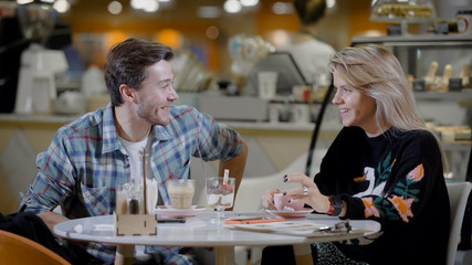 Handsome young man and attractive young woman are spending time together.