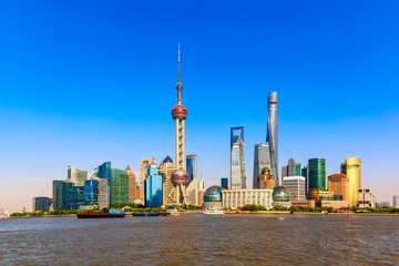 Shanghai finance business district pudong with skyscrapers. Skyline iconic shot during summer sunny...