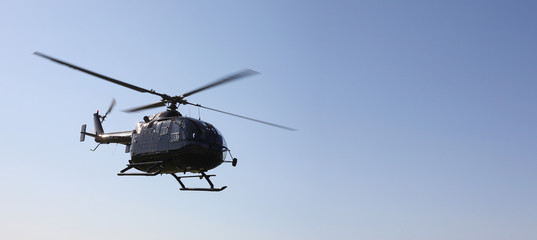 Naklejka na ściany i meble The aircraft - black helicopter flight