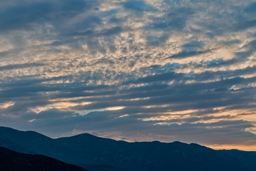 The sun rises over the mountains