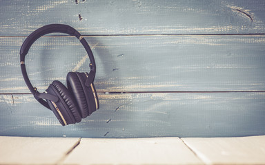 wireless headphones on vintage background