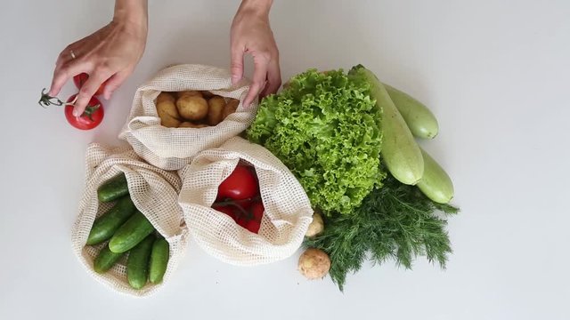 set of vegetables eco string bag hands