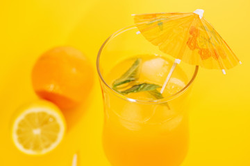Orange juice with peppermint in hurricane glass