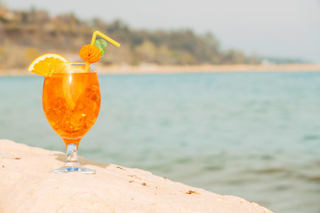 Decorated glass of light orange drink