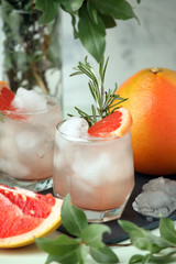 Grapefruit and rosemary gin cocktail, refreshing drink with ice, summer time, resort bar cart menu concept