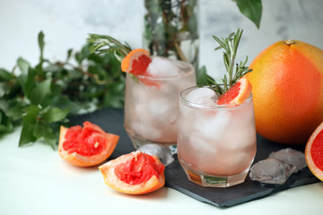 Grapefruit and rosemary gin cocktail, refreshing drink with ice, summer time, resort bar cart menu concept