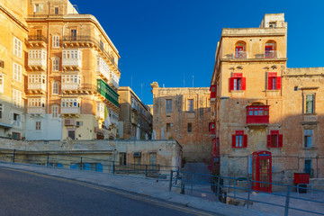 Fototapeta na wymiar Domes and roofs at sunset, Valletta , Malta