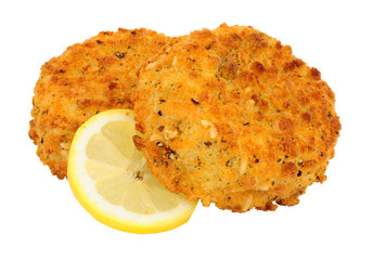 Breadcrumb covered salmon fish cakes isolated on a white background