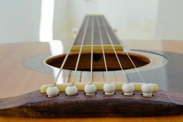 Acoustic Guitar detail - from bridge along neck - with light strip