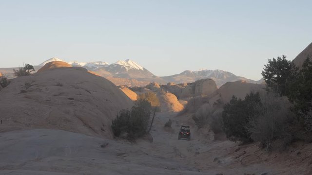 Adventure exploring in dune buggy in the mountains of Utah at sunset