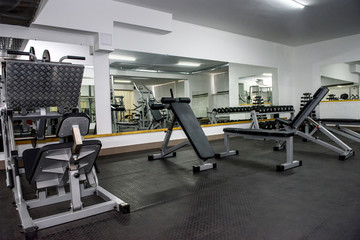 Fototapeta na wymiar Different sport equipment in modern gym closeup