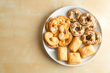 Shortbread cookies on the plate. On wooden table.
