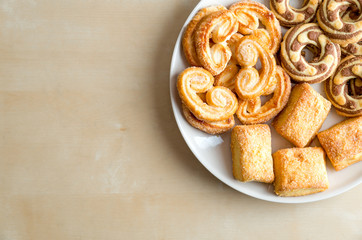 Shortbread cookies on the plate. On wooden table.