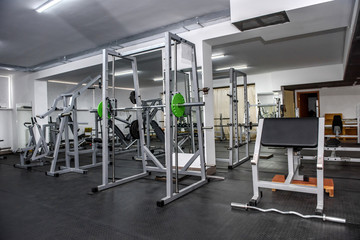 Fototapeta na wymiar Different sport equipment in modern gym closeup