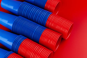 Plenty of plastic empty colorful cups close up