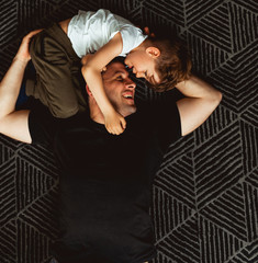 Overhead view of father and son playing