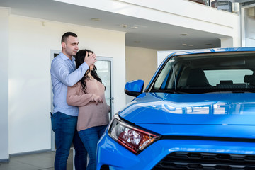 Husband making surprise to his wife in showroom