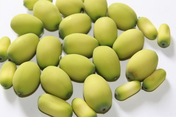 Lotus (Nelumbo nucifera) seeds against white background.Also known as sacred lotus, bean of India, Egyptian bean