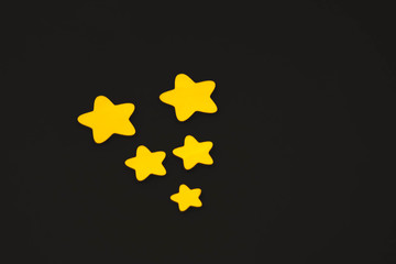 yellow stars on black background