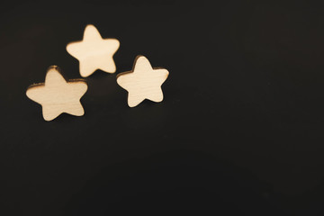 three white stars on a black background