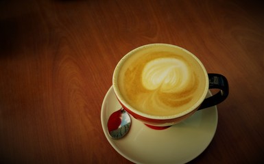cup of coffee, cappuccino, top view brown tones, copy space