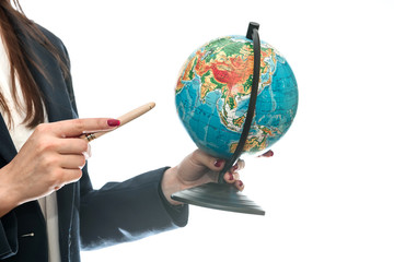 Female hand pointing at globe isolated on white