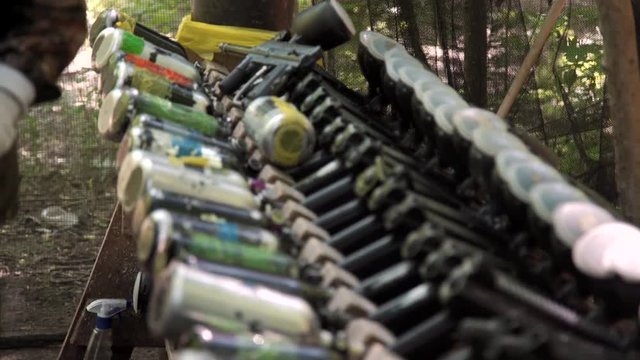Paintball guns in a row.