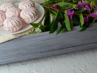 Beautiful composition with pink marshmallows and bright colors. Copy space.