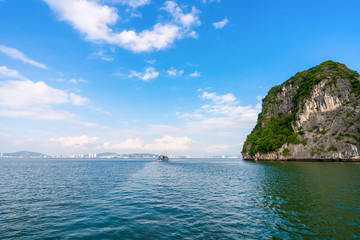 Fototapeta premium Beautiful scenery views cruising at Ha Long Bay, Hanoi, Vietnam. blue sky background summer season sunset emerald waters ocean sea, World Heritage Asia National Park Asian outdoors destinations