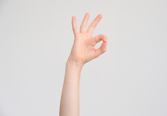 Hand of a child shows a gesture of an agreement/approval