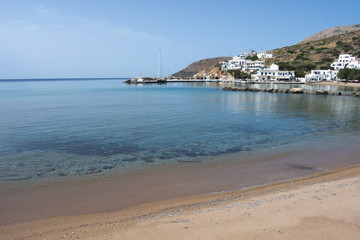 Greece, the quiet island of Sikinos in the Cyclades chain. The harbor beach.  A spring day before...