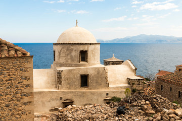 Monemvasia, Greece. A church dome in the Old Town of Monemvasia with the sea in the background