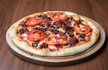 pizza with tomatoes and sausages, top view 