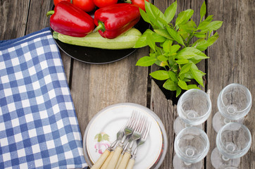 vegetables and dishes on rustic wooden table