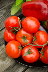 Still life of fresh organic vegetables on wooden plate, selective focus, close-up