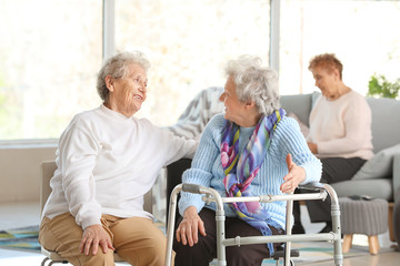 Happy senior women in nursing home - obrazy, fototapety, plakaty