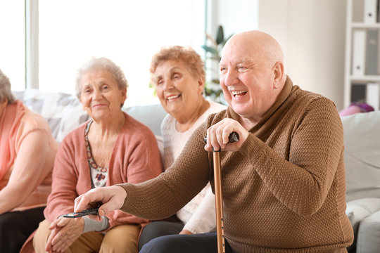 Group Of Senior People Spending Time Together In Nursing Home