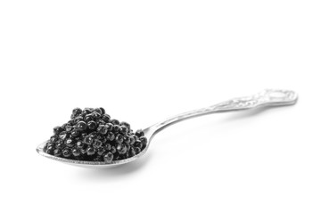 Spoon with delicious black caviar on white background