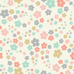 Seamless repeat of pastel stylized flowers in a tossed pattern. A pretty floral vector design background ideal for children and babies.
