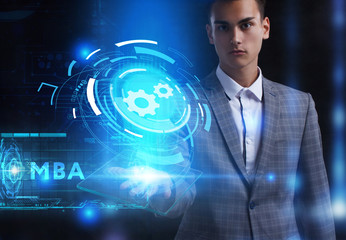 The concept of business, technology, the Internet and the network. A young entrepreneur working on a virtual screen of the future and sees the inscription: MBA