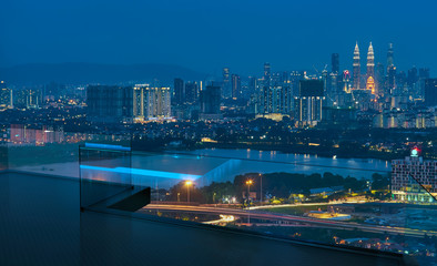 Fototapeta premium Open roof top balcony with cityscapes night view .