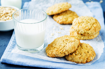 Oatmeal cookies with oats and glass of milk