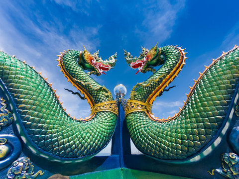 Naga or serpent statue with sunset in Wat khao phra kru temple, Chonburi province thailand, The belief of Buddhism, Thai temple.