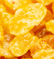 Yellow raisins as background