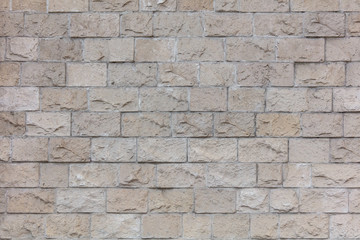 Decorative bricks on the wall of the house as a background